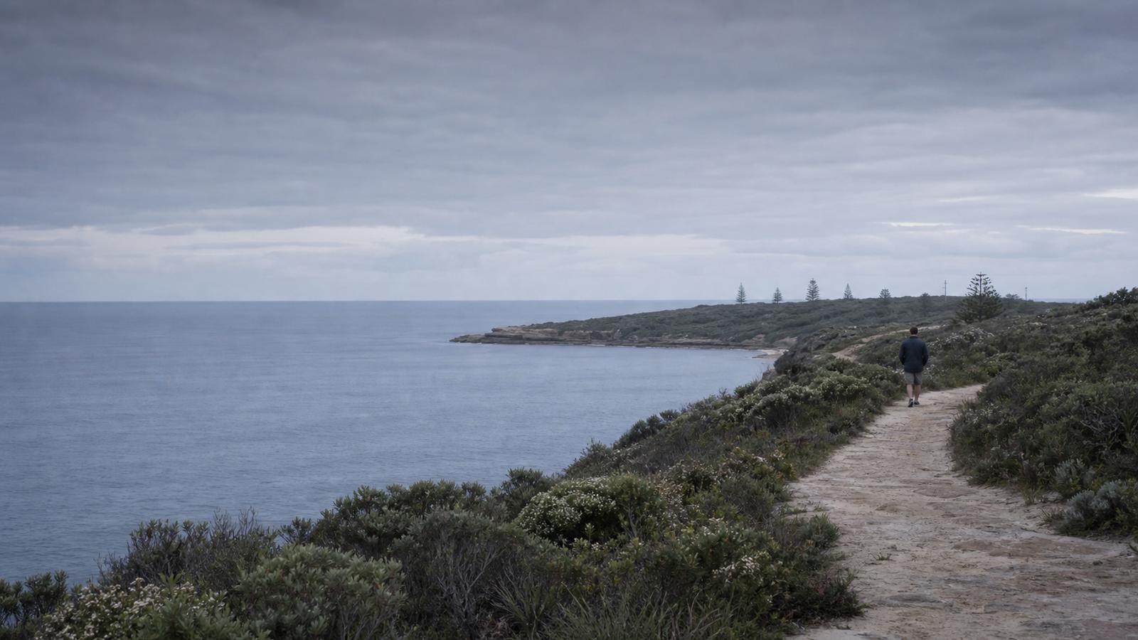 A person walking outdoors, representing recovery and daily life
